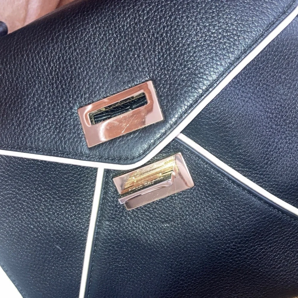 Kate Spade Elegant Black and White pebbled leather Handbag with crossbody strap